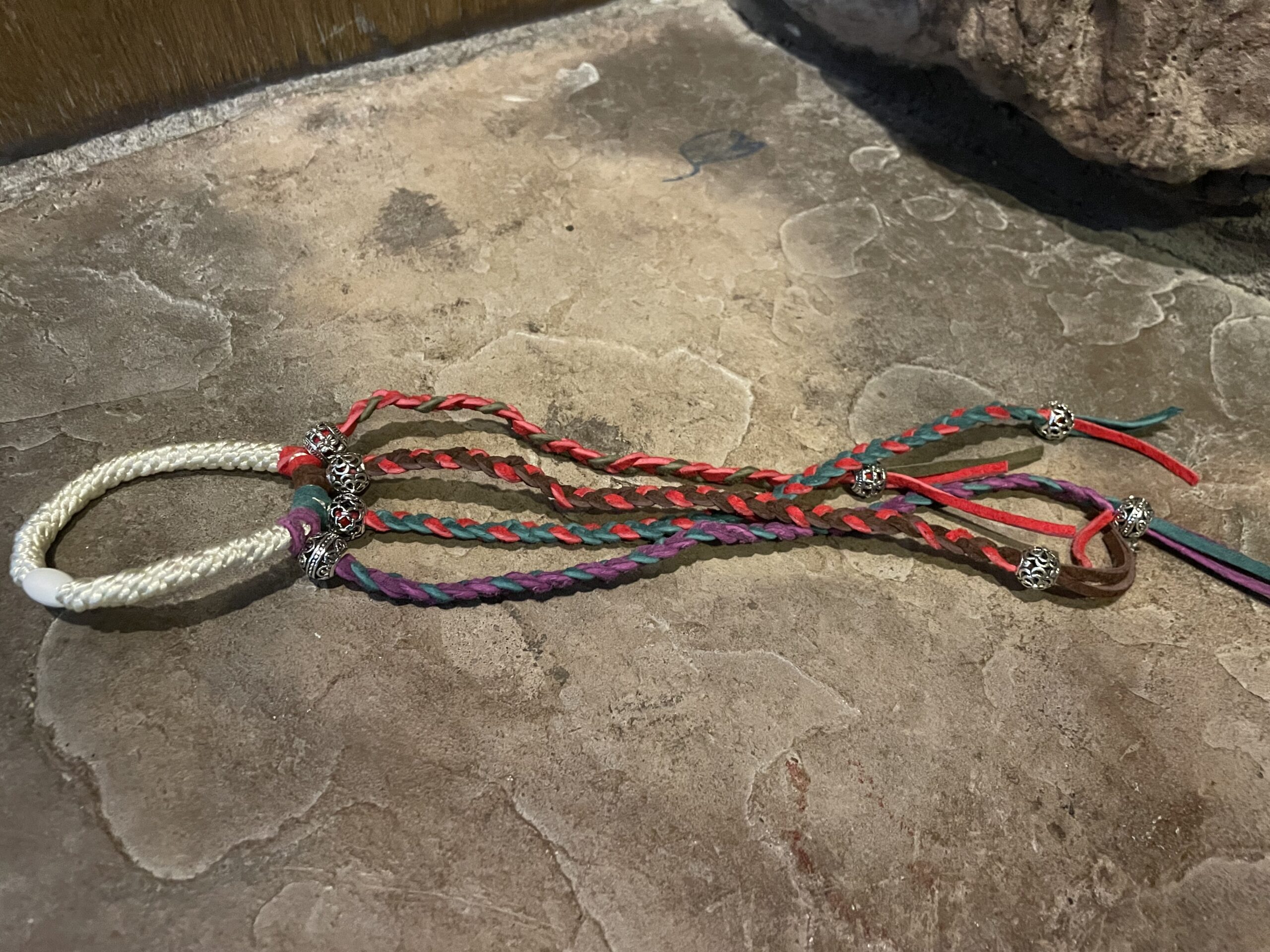 Hair-tie with leather braids